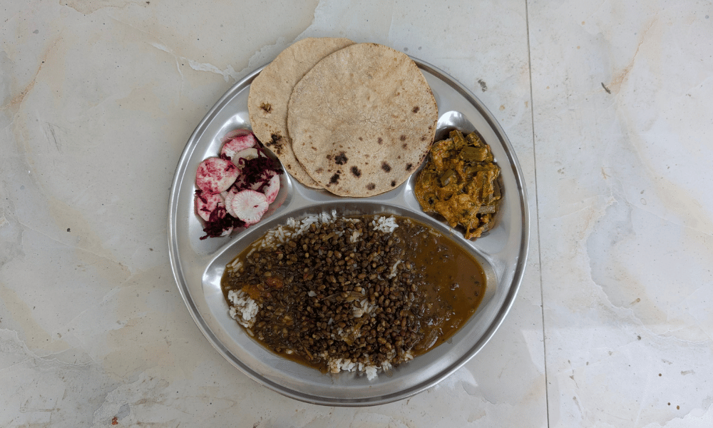Traditional Ashram Sattvic Lunch Thali with Dal, Fresh Roti, Sabzi and Salad