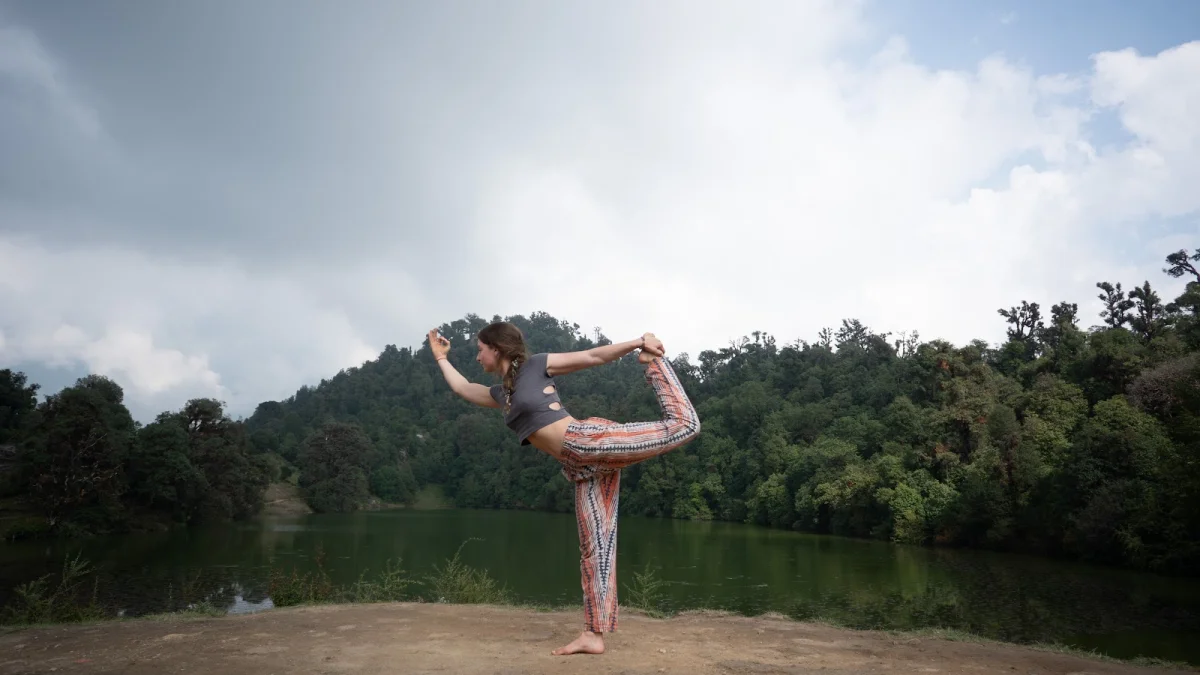 Student Practicing Natarajasana Yoga Pose Overlooking Deoria Tal Sacred Himalayan Lake