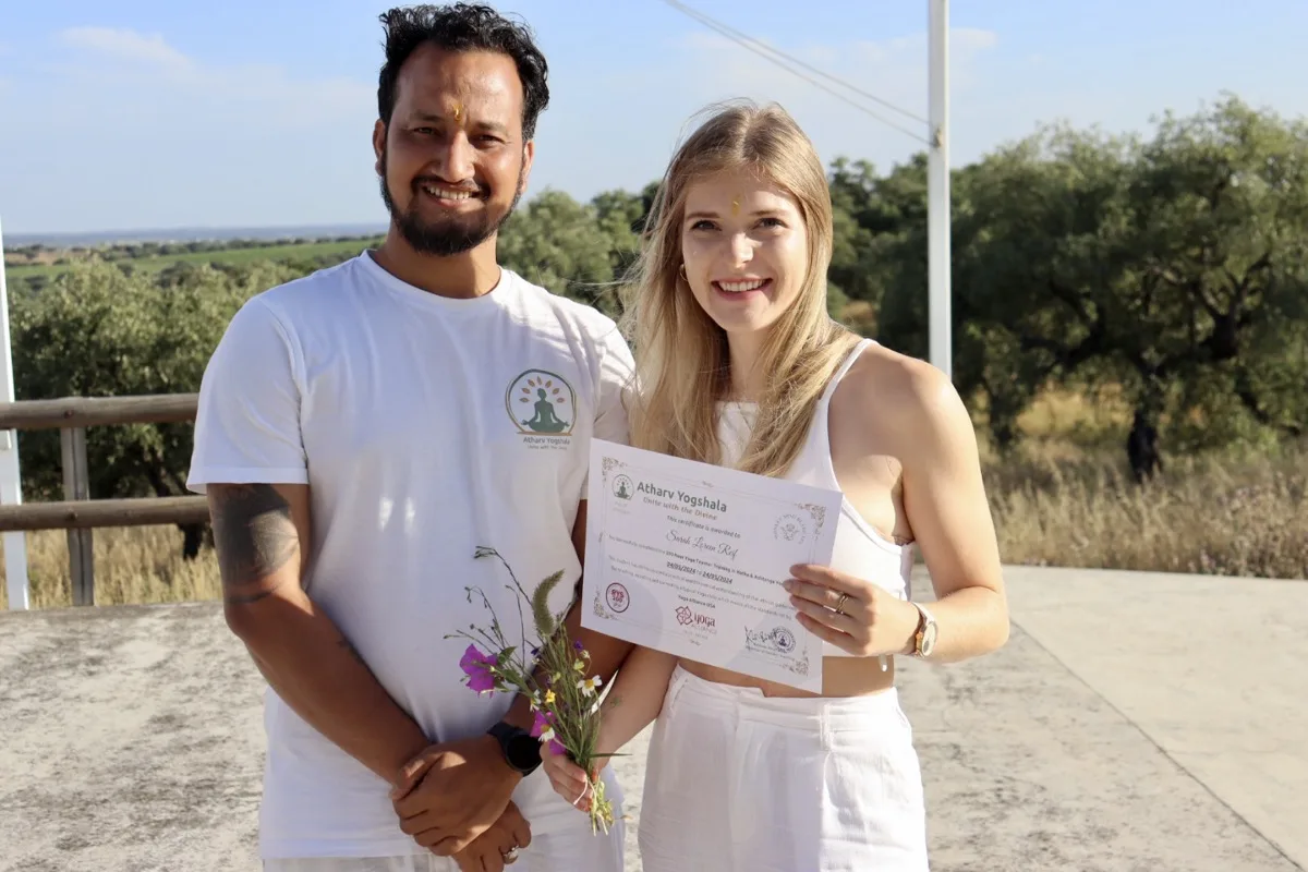 Master Teacher Awarding Yoga Alliance Certificate to Student