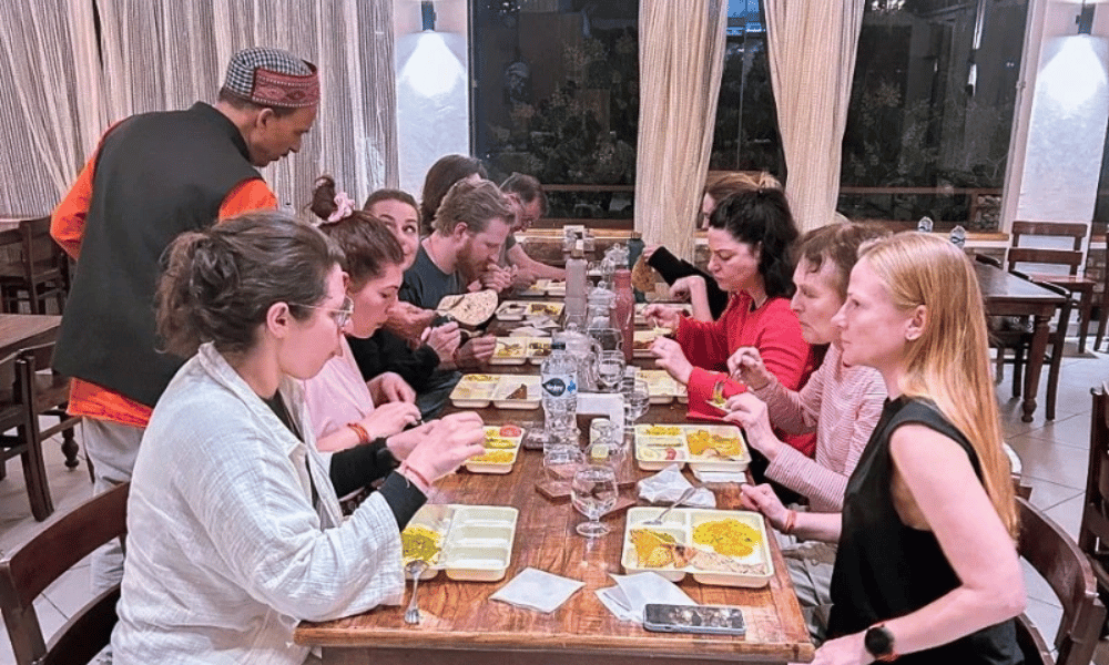 International Yoga Students Enjoying Fresh Sattvic Meals Together in Dining Hall
